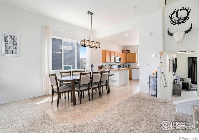 7235 Andover St, Wellington, CO 80549 - dining area featuring a chandelier, baseboards, and recessed lighting