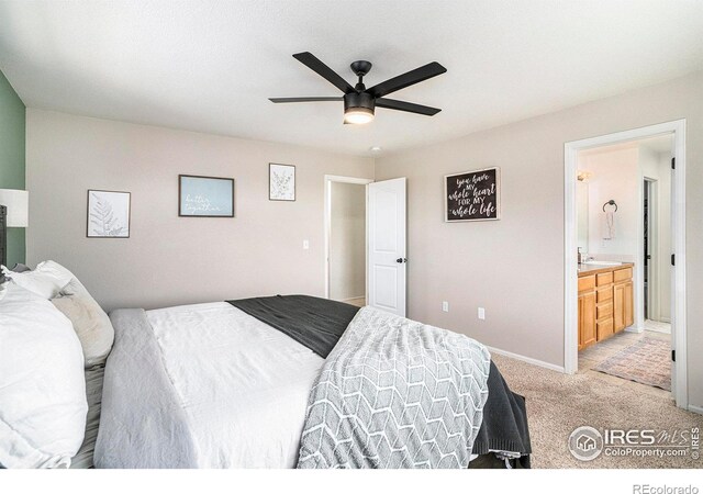 7235 Andover St, Wellington, CO 80549 - bedroom with light colored carpet, baseboards, ensuite bathroom, and ceiling fan
