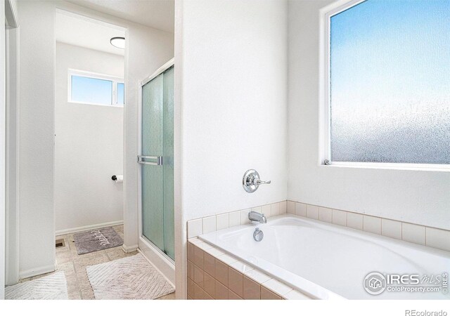 7235 Andover St, Wellington, CO 80549 - full bath with a shower stall and a bath