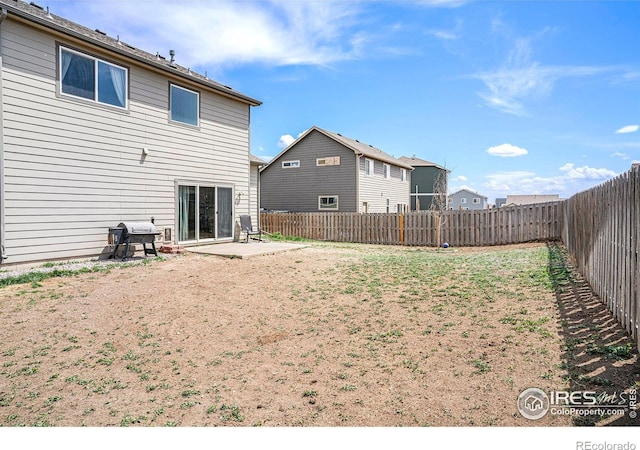 7235 Andover St, Wellington, CO 80549 - back of house with a fenced backyard and a patio area