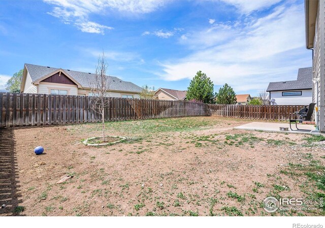 7235 Andover St, Wellington, CO 80549 - fenced backyard with a patio area