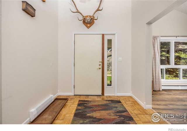 entryway featuring baseboards