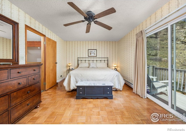 bedroom with wallpapered walls, access to outside, a textured ceiling, a baseboard radiator, and baseboards