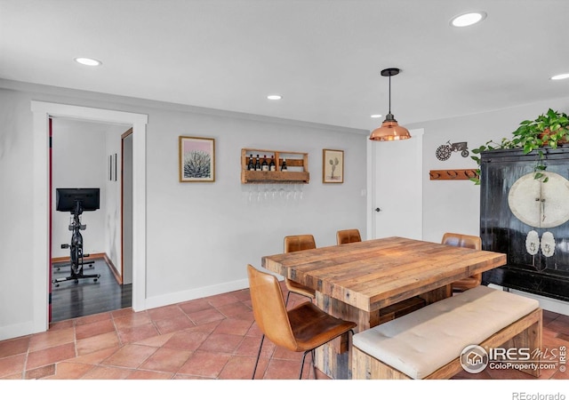 dining space with recessed lighting and baseboards