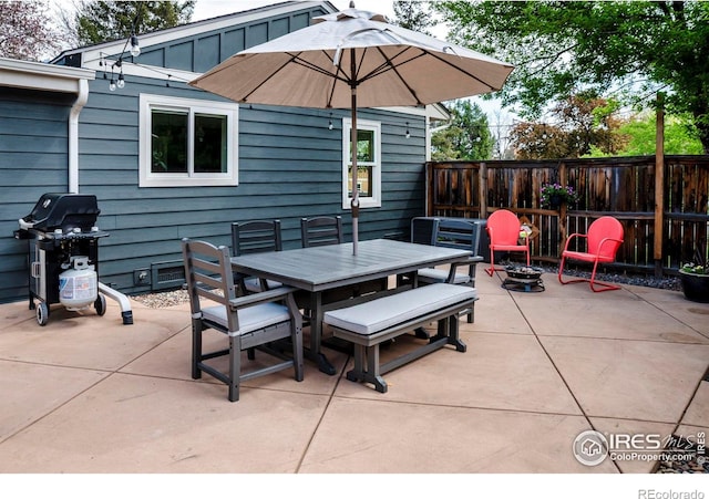 view of patio / terrace featuring outdoor dining area and fence