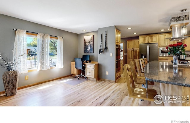 office featuring light wood-style floors, baseboards, and recessed lighting