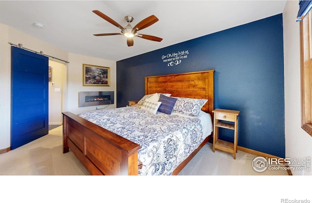 carpeted bedroom featuring baseboards and a ceiling fan