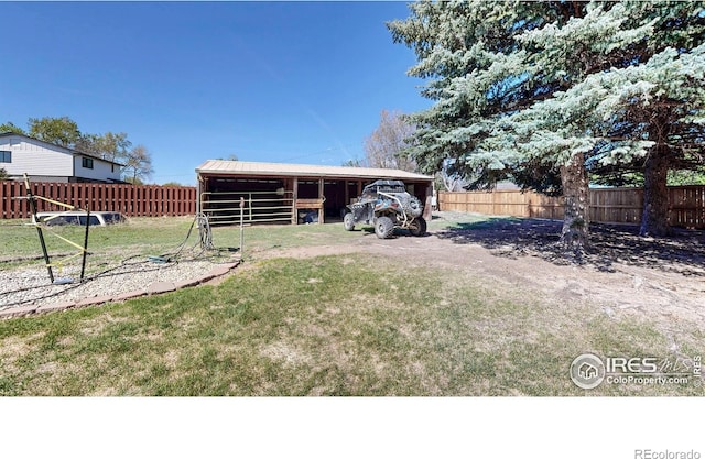 view of yard with an exterior structure and an outbuilding