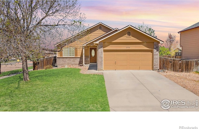 ranch-style home featuring a garage, driveway, and brick siding