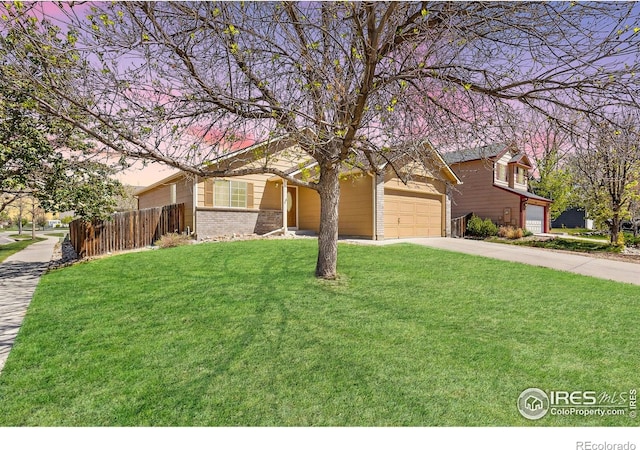 view of front of home featuring concrete driveway and brick siding