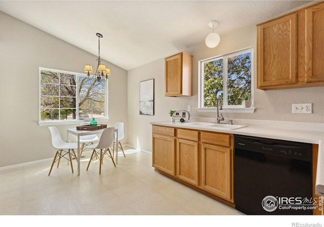 kitchen with dishwasher, a sink, light countertops, vaulted ceiling, and decorative light fixtures