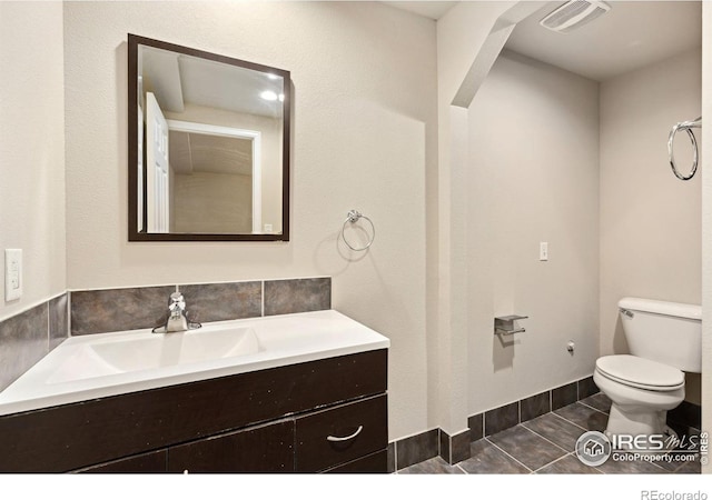 half bath with toilet and vanity