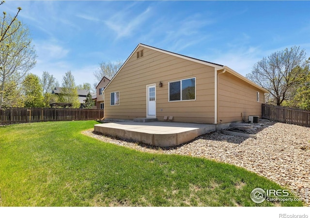 rear view of house featuring a patio area and cooling unit