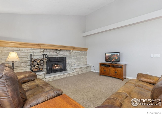 carpeted living area featuring a warm lit fireplace and baseboards