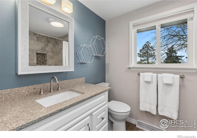 full bath with vanity, curtained shower, toilet, and wood finished floors