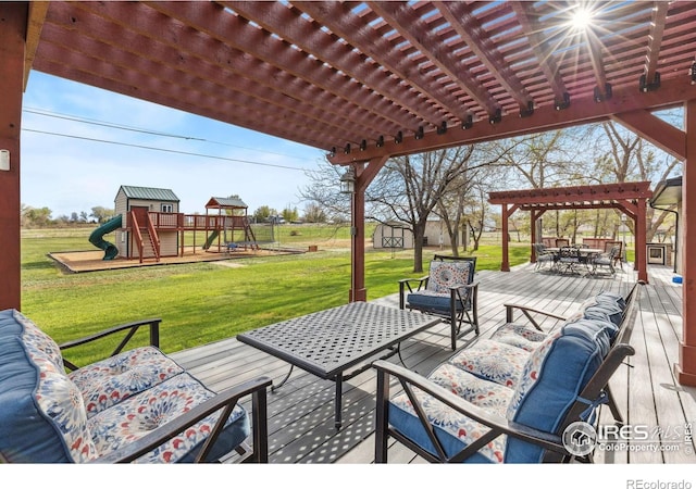 view of patio with outdoor dining area, a storage shed, a pergola, a playground, and a wooden deck