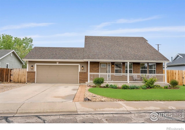 view of front of property featuring brick siding, a garage, driveway, and covered porch