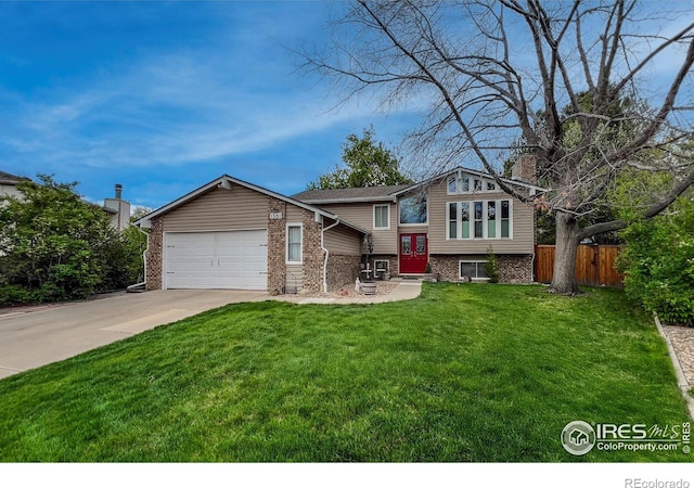 1561 Belmont Dr, Longmont, CO 80503 - view of front facade featuring a garage, concrete driveway, brick siding, and entry steps