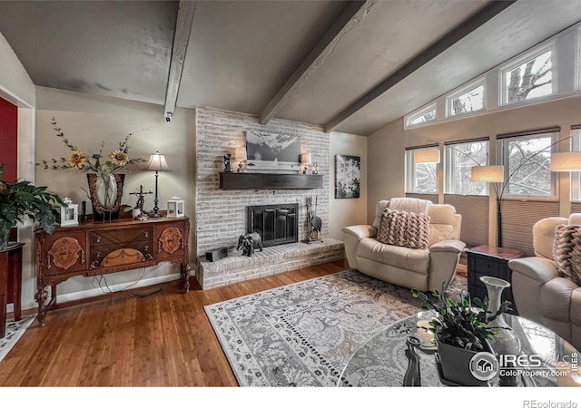 1561 Belmont Dr, Longmont, CO 80503 - living room featuring wood finished floors and a brick fireplace