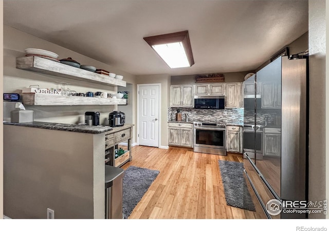1561 Belmont Dr, Longmont, CO 80503 - kitchen with electric stove, light wood-style flooring, tasteful backsplash, dark countertops, and open shelves