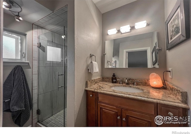 1561 Belmont Dr, Longmont, CO 80503 - bathroom featuring vanity and a shower stall