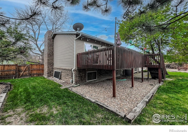 1561 Belmont Dr, Longmont, CO 80503 - back of property featuring a wooden deck, a gate, a chimney, and stairs