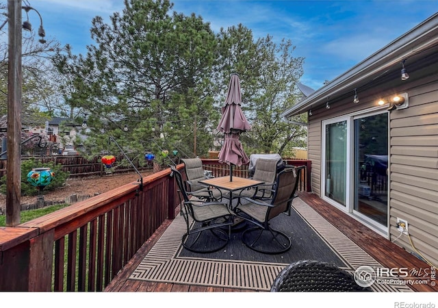 1561 Belmont Dr, Longmont, CO 80503 - wooden deck featuring outdoor dining area