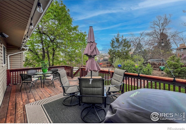 1561 Belmont Dr, Longmont, CO 80503 - wooden deck with outdoor dining space