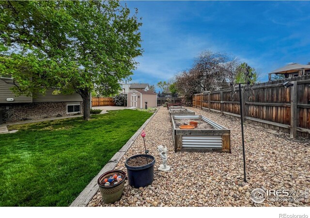 1561 Belmont Dr, Longmont, CO 80503 - view of yard featuring a vegetable garden