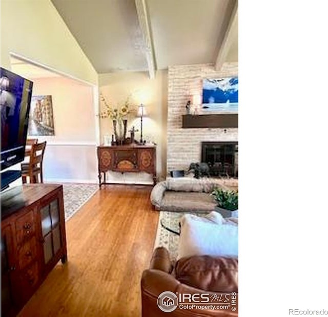 1561 Belmont Dr, Longmont, CO 80503 - living area featuring wood finished floors and a fireplace