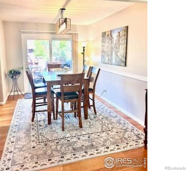 1561 Belmont Dr, Longmont, CO 80503 - dining space with wood finished floors and baseboards