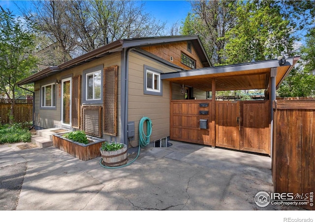 view of outbuilding with fence