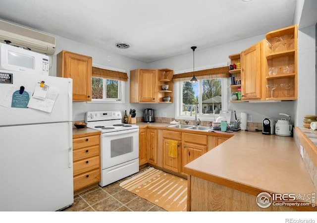 kitchen featuring white appliances, open shelves, a sink, light countertops, and hanging light fixtures