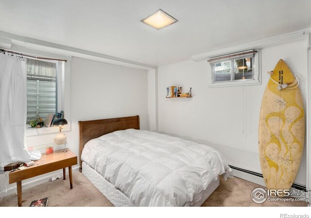 bedroom featuring carpet flooring and baseboard heating