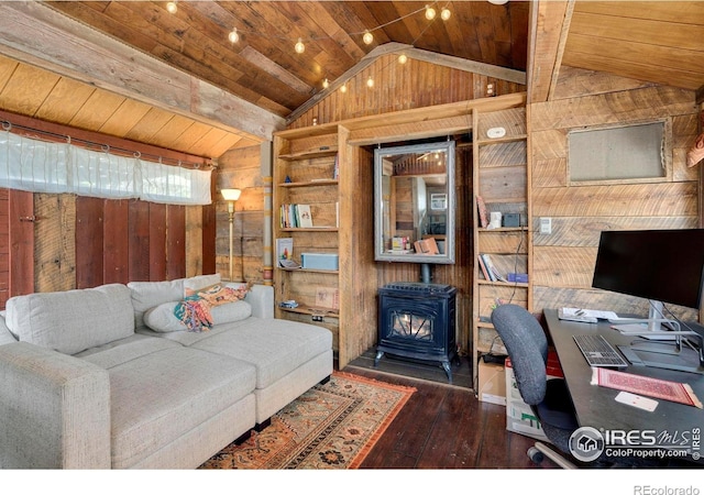 office area featuring wood walls, vaulted ceiling, a wood stove, hardwood / wood-style flooring, and wooden ceiling