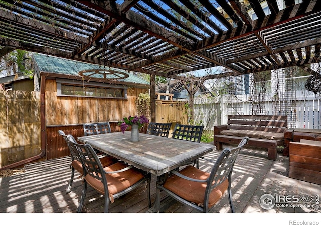 view of patio / terrace featuring fence, outdoor dining space, and a pergola