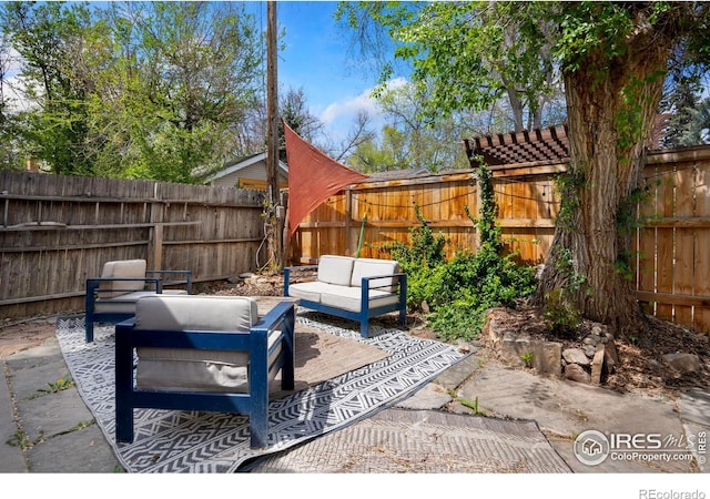 view of patio featuring outdoor lounge area and a fenced backyard