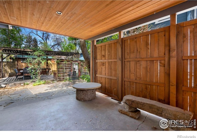view of patio with fence