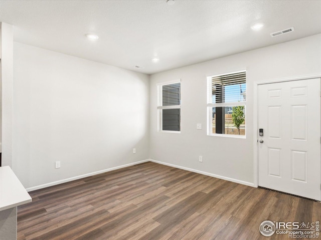 entrance foyer with wood finished floors, baseboards, and recessed lighting