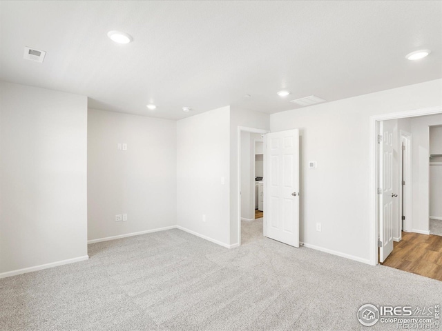 unfurnished bedroom with carpet flooring, recessed lighting, and baseboards