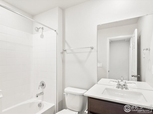 bathroom with toilet, shower / tub combination, and vanity