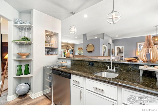 kitchen with dishwasher, a sink, white cabinetry, dark stone counters, and recessed lighting