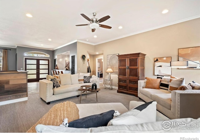 living room featuring recessed lighting, a ceiling fan, carpet, crown molding, and french doors