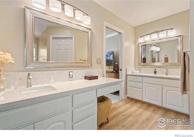 bathroom featuring vanity and wood finished floors