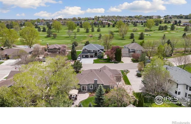 aerial perspective of suburban area featuring a local golf course