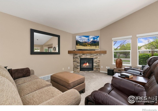 1380 Swainson Rd, Eaton, CO 80615 - carpeted living area with lofted ceiling, baseboards, and a stone fireplace