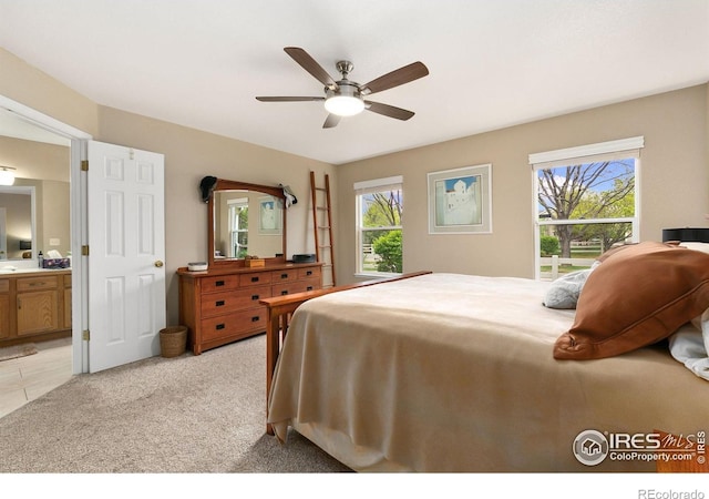 1380 Swainson Rd, Eaton, CO 80615 - bedroom with multiple windows, connected bathroom, and ceiling fan