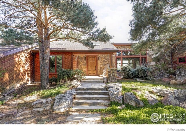 view of front of house with stone siding