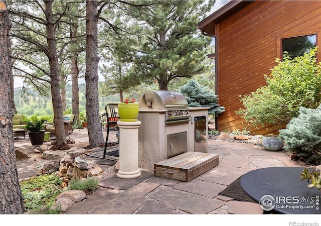 view of patio / terrace with area for grilling and an outdoor kitchen