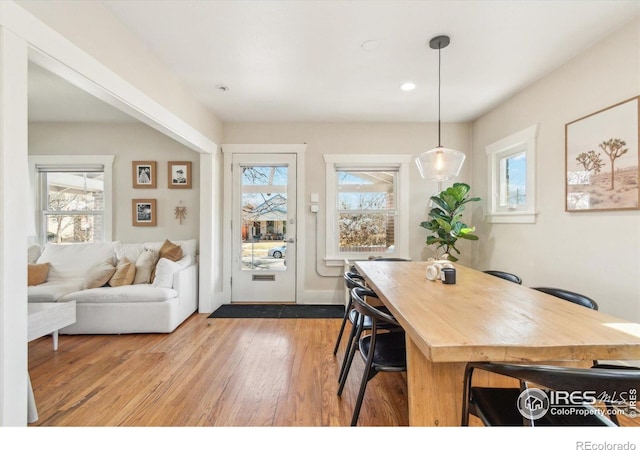 dining space featuring light wood-type flooring